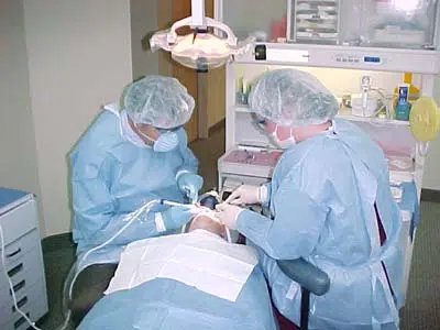 Dr. Butler and his assistant placing dental implants in a patient's mouth at Innovative Dental Ideas in Hilliard, OH