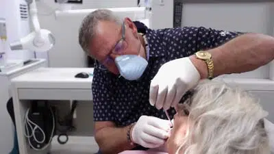 Dr. Butler providing dental care for a patient at Innovative Dental Ideas in Hilliard, OH
