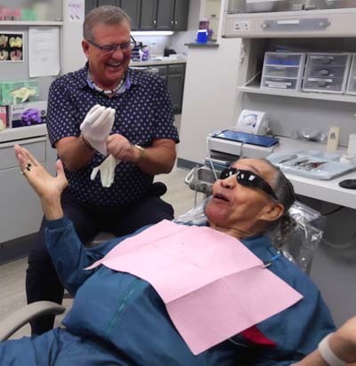 Dr. Butler laughing with one of his patients during their first dental visit at Innovative Dental Ideas in Hilliard, OH