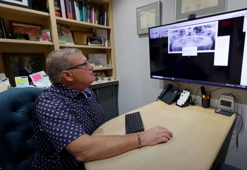 Dr. Butler reviewing patient x-rays prior to procedure
