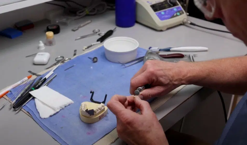 Dr. Butler prepping a dental implant for a patient