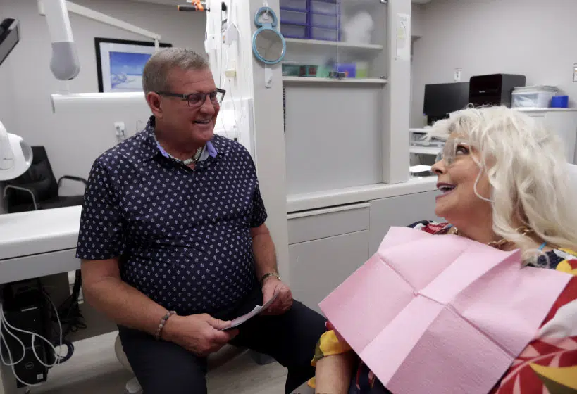 Dr. Butler at Innovative Dental Ideas speaking to a dental implant consult patient