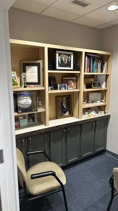 Dr. Hilliard's office featuring photos of his family
